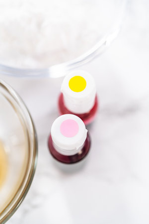 Measured ingredients in glass mixing bowls to bake Easter meringue cookies.の写真素材