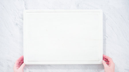 Flat lay. Step by step. Cheese board with candies and cookies for Valentines Day.の写真素材