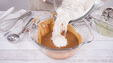 Mixing ingredients to bake chocolate raspberry cupcakes.