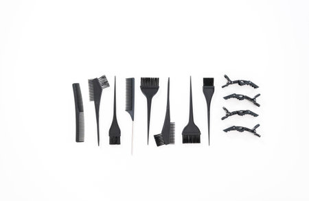 Flat lay. Hair color dying plastic brushes on a white background.の写真素材