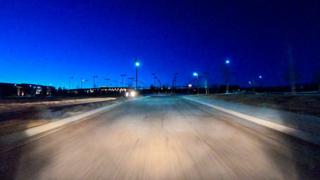 Denver, Colorado, USA-January 17, 2020 - Driving on typical paved roads at night in suburban America.のeditorial素材