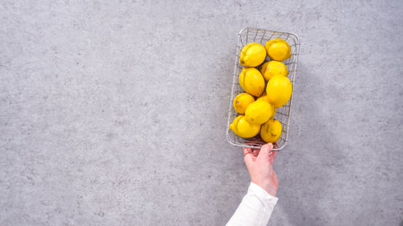 Flat lay. Step by step. Ingredients in glass mixing bowls to prepare lemon cranberry bundt cake.の写真素材