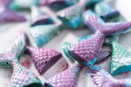 Homemade chocolate mermaid tails covered with glitter dust.の写真素材