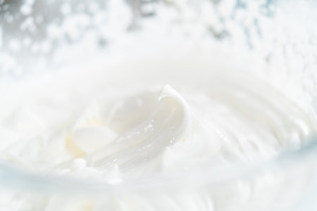 Preparing homemade coconut ice cream with roasted coconut flakes.の写真素材