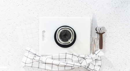 Flat lay. Scoring chocolate peanut butter fudge for cutting into small pieces.の写真素材