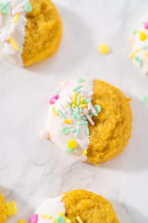 Lemon Cookies with White Chocolate. Dipping lemon cookies into melted white chocolate and decorating...
