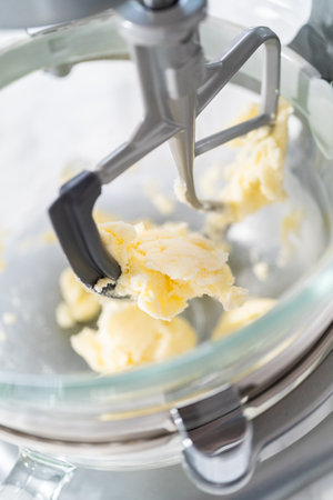Lemon Cookies with White Chocolate. Mixing ingredients in kitchen mixer to bake lemon cookies with white chocolate.の写真素材