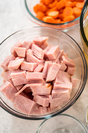 Measured ingredients in glass mixing bowls to make split pea soup.の写真素材