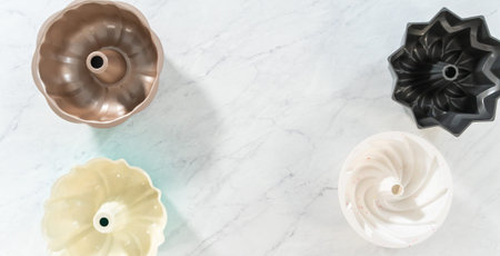 Flat lay. Variety of bundt cake pans on the kitchen counter.