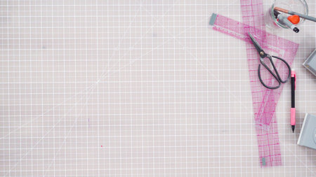 Flat lay. Little girl making a handmade Fathers Day card from construction paper.の写真素材