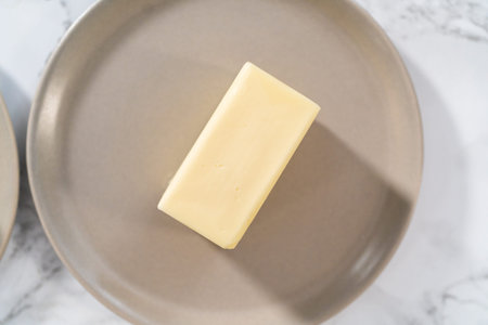 Sticks of unsalted butter on the small plates.の写真素材