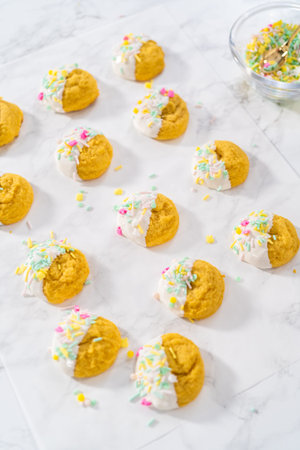 Lemon Cookies with White Chocolate. Dipping lemon cookies into melted white chocolate and decorating...