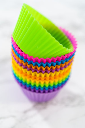 New silicone cupcake liners of different colors on the kitchen counter.の写真素材