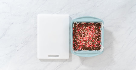 Flat lay. Cooling freshly baked peppermint brownies with chocolate peppermint chips on a kitchen...