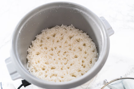 Cilantro Lime Rice. Cooking white long grain rice in a rice cooker.の写真素材