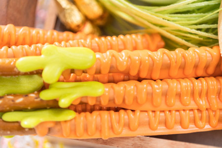 Assembling charcuterie board with Easter candies, cookies, and marshmallows.の写真素材