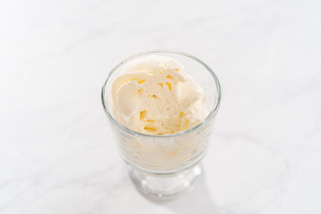 Homemade whipped cream in a class ice cream bowl.の写真素材