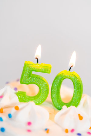 Little birthday cake for 50th birthday on a white cake plate.の写真素材