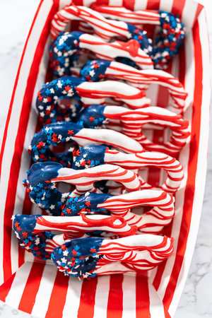 American flag. Red, white, and blue chocolate-covered pretzel twists.の写真素材