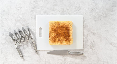 Flat lay. Scoring eggnog fudge with a wheel dough cutter for cutting into small pieces.