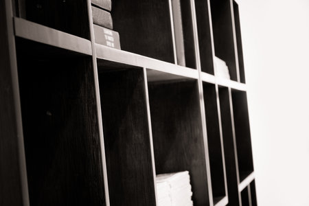 Contemporary book shelf with a few books.の写真素材