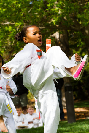 Tae Kwon Do student practicing in the park.のeditorial素材