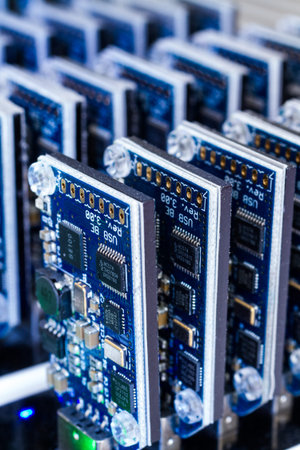 Bitcoin mining USB devices in a row with small fans.
