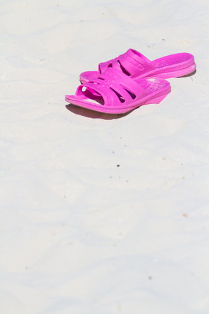 Pink sandals on the bach.の写真素材