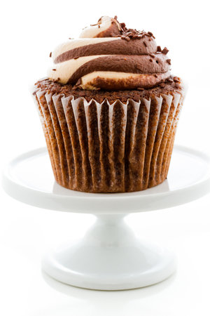 Gourmet chocolate caramel swirl cupcake with chocolate sprikles.の写真素材