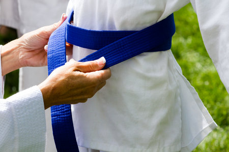 Tae Kwon Do student practicing in the park.の写真素材