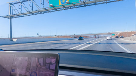 Las Vegas, Nevada, USA-December 3, 2022-Cruising through Las Vegas in a sleek Tesla vehicle on...