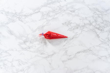 Flat lay. Melted chocolate in a piping bag.の写真素材