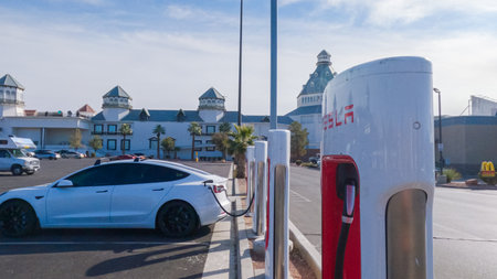 Primm, Nevada, USA-December 3, 2022-During the day, a Tesla vehicle is seen charging at a Tesla Supercharging station, utilizing the high-speed charging infrastructure for convenient and efficient electric vehicle refueling.のeditorial素材