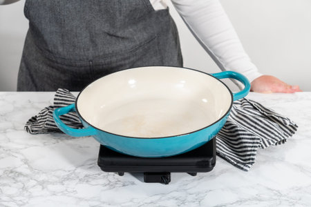 Browning ground beef in cast iron skillet to make homemade hamburger helper.の写真素材