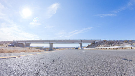 Embarking on a road trip from Nevada to California, driving on Highway 15 during the day offers...