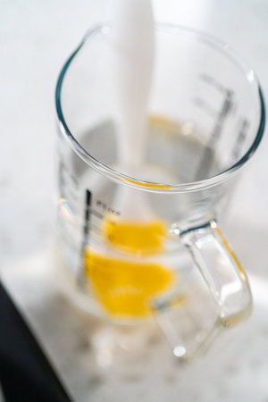Caramelizing sugar in a saucepan to make caramel cupcake toppers.の写真素材