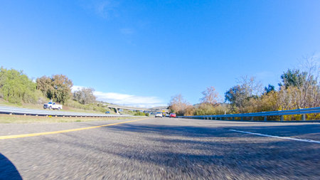 On a crisp winter day, a car cruises along the iconic Highway 1 near San Luis Obispo, California....