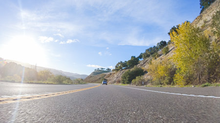 Basking in the beauty of a sunny winter day, driving on HWY 1 near Las Cruces, California offers stunning views of the picturesque coastal landscape against a backdrop of clear blue skies.の写真素材