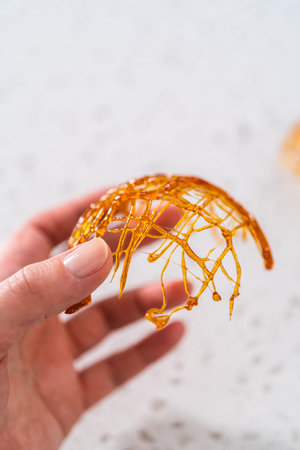 Crunchy caramel cupcake toppers on the counter.