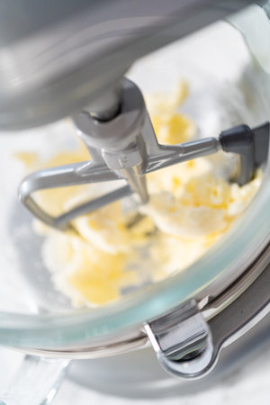Lemon Cookies with White Chocolate. Mixing ingredients in kitchen mixer to bake lemon cookies with white chocolate.の写真素材