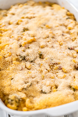 Cooking macaroni and cheese with broccoli in a casserole dish.の写真素材