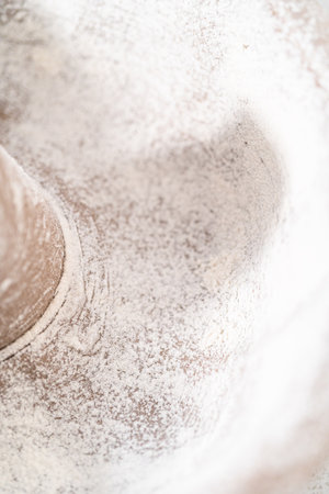 Greasing metal bundt cake pan to bake a simple vanilla bundt cake.の写真素材