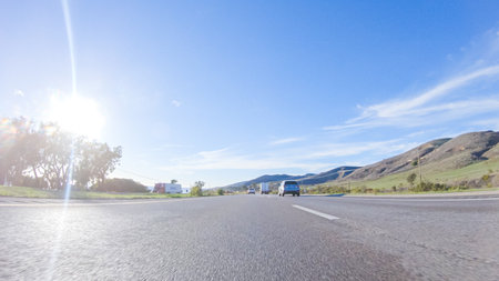 During the day, driving on HWY 101 near Arroyo Quemada Beach, California, offers scenic views of the surrounding coastal landscape.の写真素材