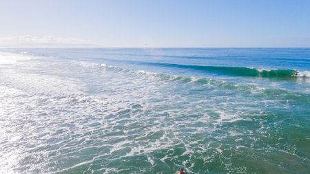 Pismo Beach is strikingly empty during a winter day, offering a serene and peaceful atmosphere with its expansive sandy shore and the soothing sounds of the waves.の写真素材