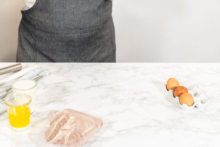 The measured ingredients are gathered on the counter - ready to be combined and create this delightful Chocolate Bundt Cake.の写真素材