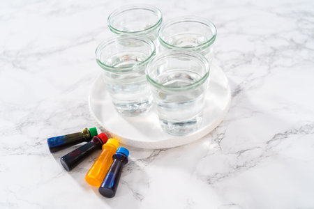 Coloring hard-boiled white eggs with natural food coloring.の写真素材