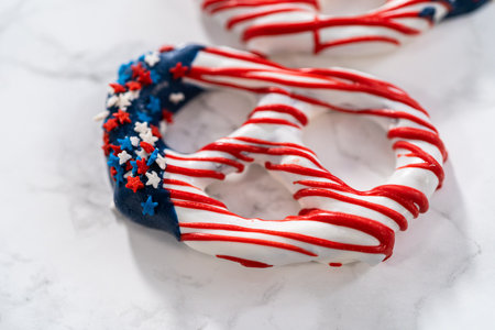 American flag. Red, white, and blue chocolate-covered pretzel twists.の写真素材
