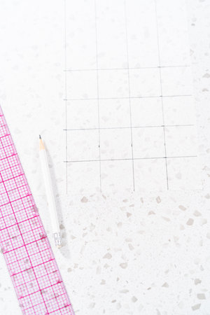Preparing cutting template from parchment paper to cut homemade fudge.の写真素材