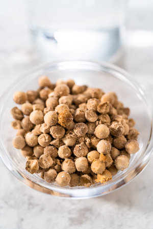 Measured ingredients in glass mixing bowls to prepare boba pearls.