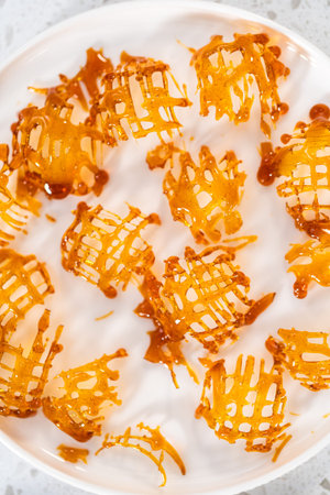 Crunchy caramel cupcake toppers on the counter.の写真素材